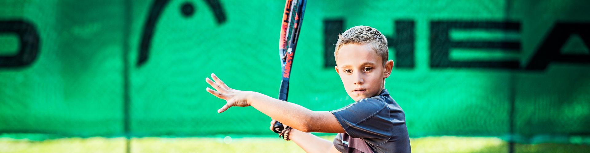 Boy playing Tennis